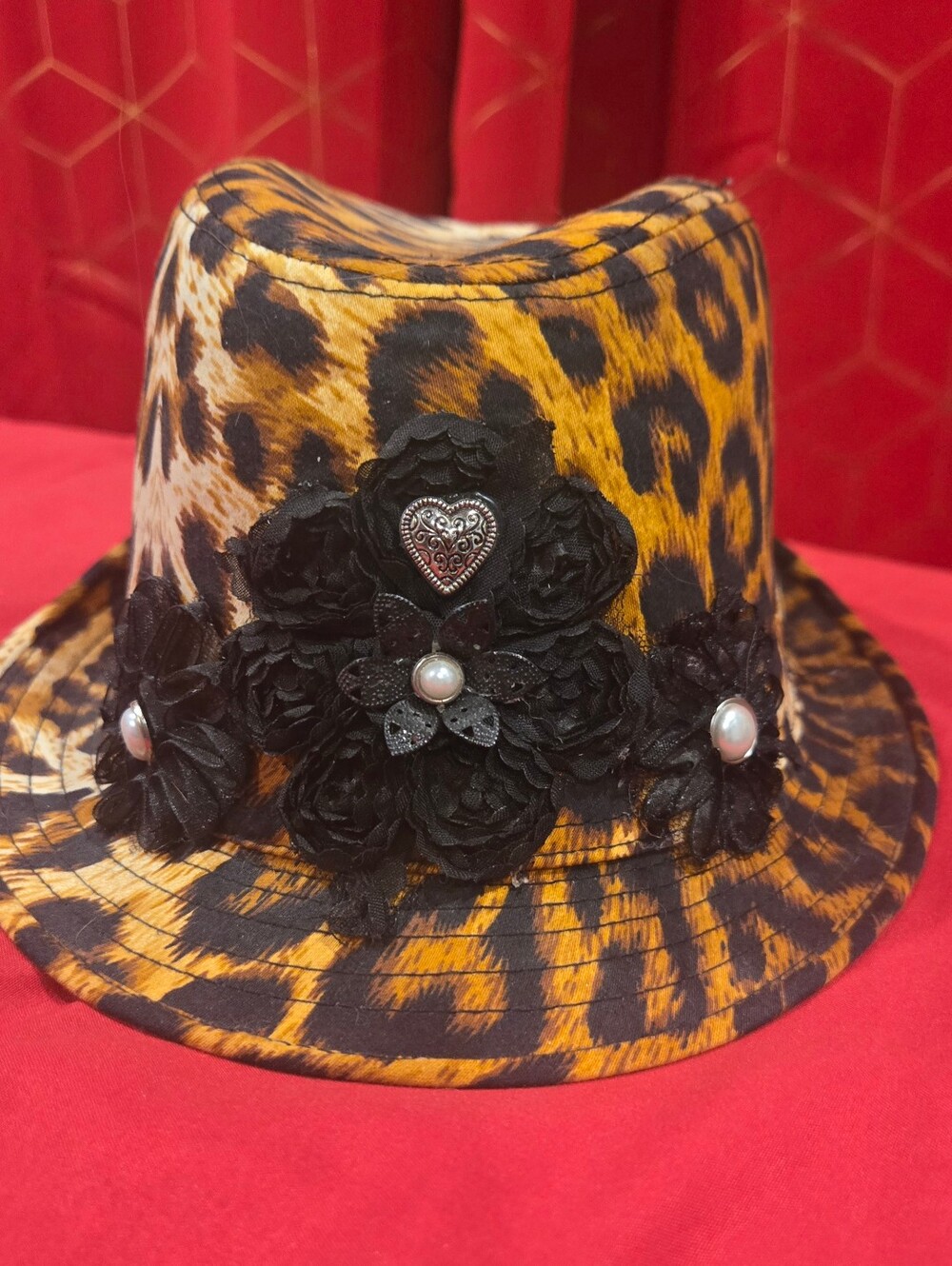 Toppers Original Leopard Print Women’s Fedora Hat with Black Floral Trim.